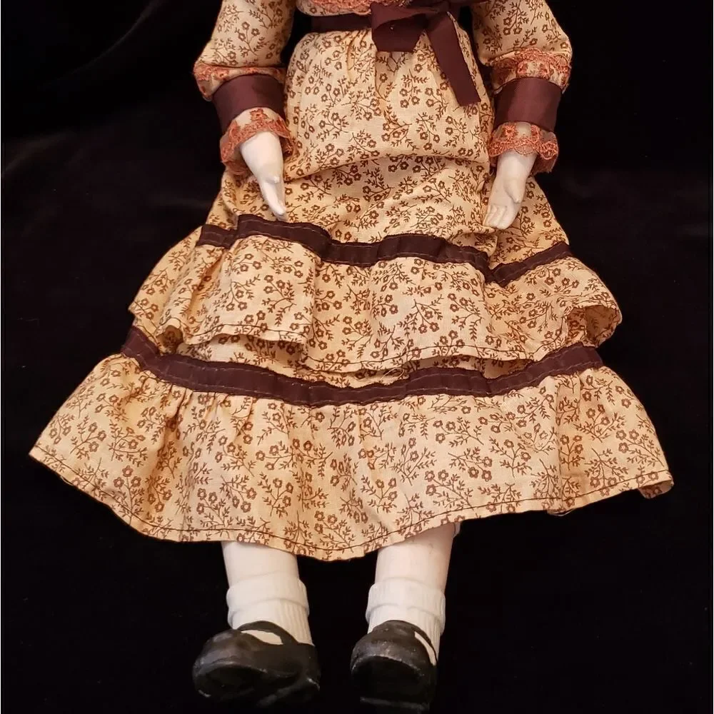 Vintage Porcelain Doll with Brown Dress and Hat